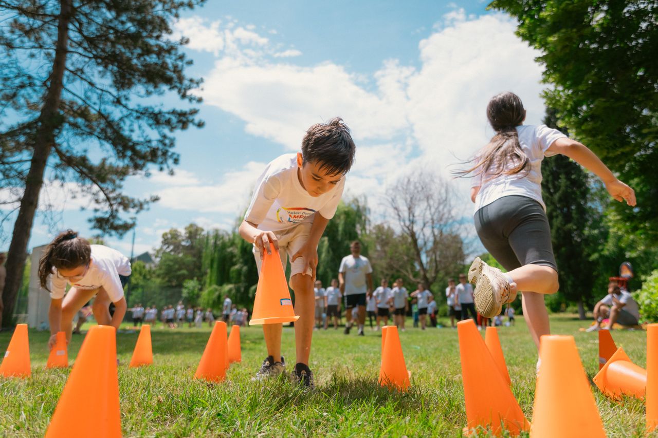 Kids mid-drill at a sports camp